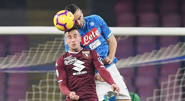  NAPLES, ITALY - FEBRUARY 17: Nikola Maksimovic of SSC Napoli vies Alex Berenguer of Torino FC during the Serie A match between SSC Napoli and Torino FC at Stadio San Paolo on February 17, 2019 in Naples, Italy. (Photo by Francesco Pecoraro/Getty Images) 