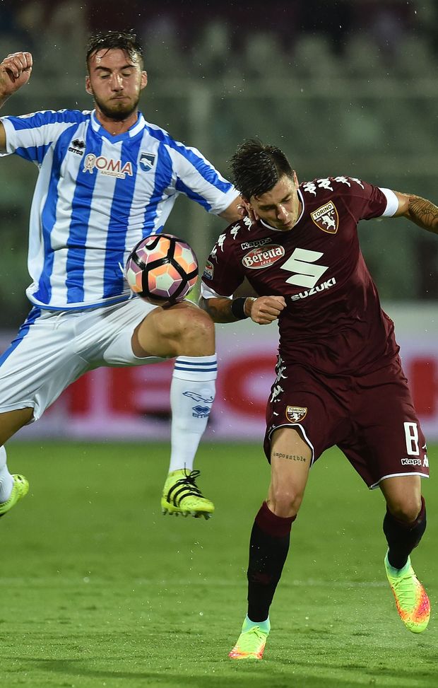 PESCARA, ITALY - SEPTEMBER 21: Cristiano Biraghi of Pescara Calcio and Daniele Baselli of FC Torino in action during the Serie A match between Pescara Calcio and FC Torino at Adriatico Stadium on September 21, 2016 in Pescara, Italy. (Photo by Giuseppe Bellini/Getty Images) PESCARA, ITALY - SEPTEMBER 21: Cristiano Biraghi of Pescara Calcio and Daniele Baselli of FC Torino in action during the Serie A match between Pescara Calcio and FC Torino at Adriatico Stadium on September 21, 2016 in Pescara, Italy. (Photo by Giuseppe Bellini/Getty Images)