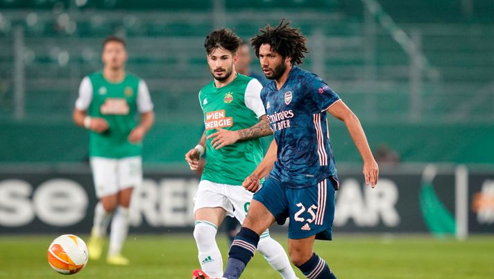 VIENNA, AUSTRIA - OCTOBER 22: Mohamed Elneny of Arsenal looks to break past Taxiarchis Fountas of Rapid Vienna during the UEFA Europa League Group B stage match between Rapid Wien and Arsenal FC at Allianz Stadion on October 22, 2020 in Vienna, Austria. Rapid Wien are allowing a limited number of 3000 spectators to be in attendance as Covid-19 pandemic restrictions are eased. (Photo by Chris Hofer/Getty Images) VIENNA, AUSTRIA - OCTOBER 22: Mohamed Elneny of Arsenal looks to break past Taxiarchis Fountas of Rapid Vienna during the UEFA Europa League Group B stage match between Rapid Wien and Arsenal FC at Allianz Stadion on October 22, 2020 in Vienna, Austria. Rapid Wien are allowing a limited number of 3000 spectators to be in attendance as Covid-19 pandemic restrictions are eased. (Photo by Chris Hofer/Getty Images)