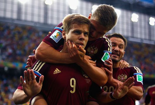 CURITIBA, BRAZIL - JUNE 26: Alexander Kokorin of Russia celebrates scoring his team's first goal with teammate Oleg Shatov on his back during the 2014 FIFA World Cup Brazil Group H match between Algeria and Russia at Arena da Baixada on June 26, 2014 in Curitiba, Brazil. (Photo by Clive Rose/Getty Images) CURITIBA, BRAZIL - JUNE 26: Alexander Kokorin of Russia celebrates scoring his team's first goal with teammate Oleg Shatov on his back during the 2014 FIFA World Cup Brazil Group H match between Algeria and Russia at Arena da Baixada on June 26, 2014 in Curitiba, Brazil. (Photo by Clive Rose/Getty Images)