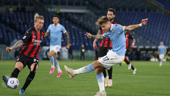 ROME, ITALY - APRIL 26: Ciro Immobile of SS Lazio takes a shot past Simon Kjaer of A.C. Milan during the Serie A match between SS Lazio and AC Milan at Stadio Olimpico on April 26, 2021 in Rome, Italy. Sporting stadiums around Italy remain under strict restrictions due to the Coronavirus Pandemic as Government social distancing laws prohibit fans inside venues resulting in games being played behind closed doors. (Photo by Paolo Bruno/Getty Images) ROME, ITALY - APRIL 26: Ciro Immobile of SS Lazio takes a shot past Simon Kjaer of A.C. Milan during the Serie A match between SS Lazio and AC Milan at Stadio Olimpico on April 26, 2021 in Rome, Italy. Sporting stadiums around Italy remain under strict restrictions due to the Coronavirus Pandemic as Government social distancing laws prohibit fans inside venues resulting in games being played behind closed doors. (Photo by Paolo Bruno/Getty Images)