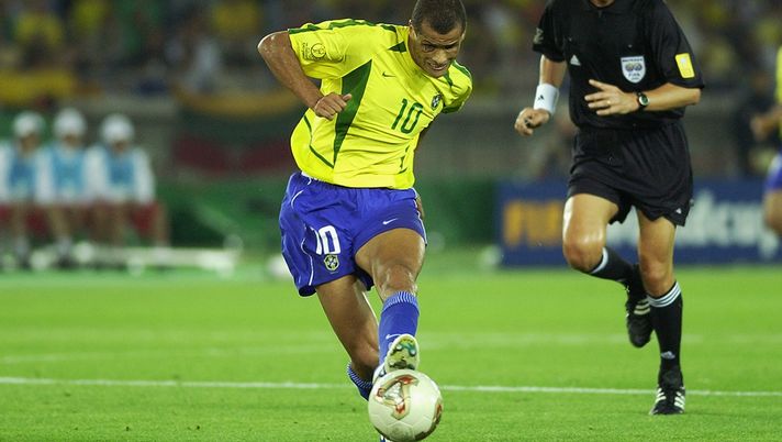YOKOHAMA - JUNE 30:  Rivaldo of Brazil is watched by referee Pierluigi Collina during the Germany v Brazil, World Cup Final match played at the International Stadium Yokohama, Yokohama, Japan on June 30, 2002. Brazil won 2-0. (Photo by Gary M. Prior/Getty Images)  YOKOHAMA - JUNE 30:  Rivaldo of Brazil is watched by referee Pierluigi Collina during the Germany v Brazil, World Cup Final match played at the International Stadium Yokohama, Yokohama, Japan on June 30, 2002. Brazil won 2-0. (Photo by Gary M. Prior/Getty Images)