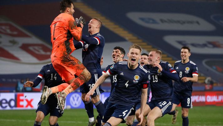 BELGRADE, SERBIA - NOVEMBER 12: David Marshall of Scotland celebrates with Leigh Griffiths of Scotland and Scott McTominay of Scotland and his team as they celebrate after their victory in the UEFA EURO 2020 Play-Off Final between Serbia and Scotland at Rajko Mitic Stadium on November 12, 2020 in Belgrade, Serbia. Football Stadiums around Europe remain empty due to the Coronavirus Pandemic as Government social distancing laws prohibit fans inside venues resulting in fixtures being played behind closed doors. (Photo by Srdjan Stevanovic/Getty Images) BELGRADE, SERBIA - NOVEMBER 12: David Marshall of Scotland celebrates with Leigh Griffiths of Scotland and Scott McTominay of Scotland and his team as they celebrate after their victory in the UEFA EURO 2020 Play-Off Final between Serbia and Scotland at Rajko Mitic Stadium on November 12, 2020 in Belgrade, Serbia. Football Stadiums around Europe remain empty due to the Coronavirus Pandemic as Government social distancing laws prohibit fans inside venues resulting in fixtures being played behind closed doors. (Photo by Srdjan Stevanovic/Getty Images)