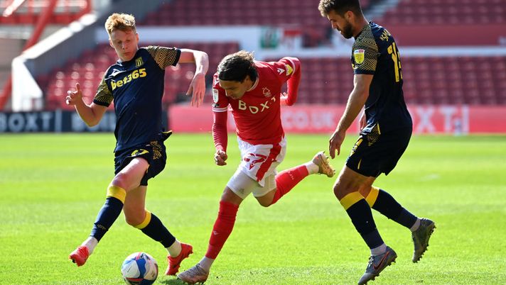 NOTTINGHAM, ENGLAND - APRIL 24: Filip Krovinovic of Nottingham Forest battles for possession with Tommy Smith of Stoke City during the Sky Bet Championship match between Nottingham Forest and Stoke City at City Ground on April 24, 2021 in Nottingham, England. Sporting stadiums around the UK remain under strict restrictions due to the Coronavirus Pandemic as Government social distancing laws prohibit fans inside venues resulting in games being played behind closed doors. (Photo by Ross Kinnaird/Getty Images) NOTTINGHAM, ENGLAND - APRIL 24: Filip Krovinovic of Nottingham Forest battles for possession with Tommy Smith of Stoke City during the Sky Bet Championship match between Nottingham Forest and Stoke City at City Ground on April 24, 2021 in Nottingham, England. Sporting stadiums around the UK remain under strict restrictions due to the Coronavirus Pandemic as Government social distancing laws prohibit fans inside venues resulting in games being played behind closed doors. (Photo by Ross Kinnaird/Getty Images)