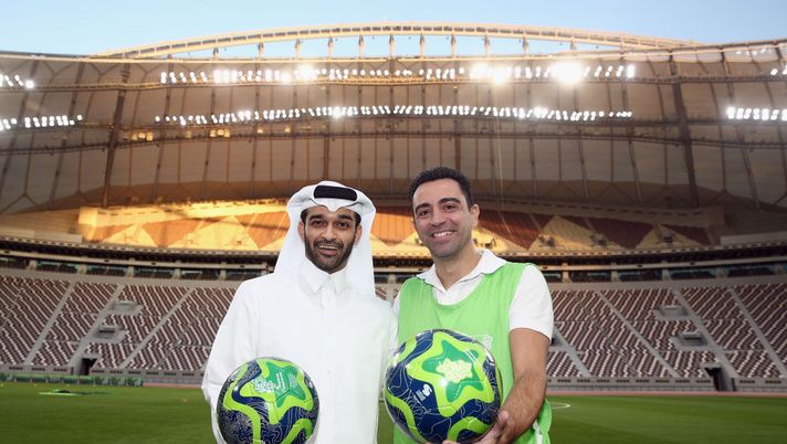 DOHA, QATAR - JANUARY 04: Hassan Al Thawadi, the Secretary General of the Qatar's Supreme Committee for Delivery and Legacy (SC) poses with former Spanish football professional and World Cup 2022 ambassador Xavi Hernandez during a presentation at the at Khalifa International Stadium on January 4, 2018 in Doha, Qatar. (Photo by Alex Grimm/Bongarts/Getty Images) DOHA, QATAR - JANUARY 04: Hassan Al Thawadi, the Secretary General of the Qatar's Supreme Committee for Delivery and Legacy (SC) poses with former Spanish football professional and World Cup 2022 ambassador Xavi Hernandez during a presentation at the at Khalifa International Stadium on January 4, 2018 in Doha, Qatar. (Photo by Alex Grimm/Bongarts/Getty Images)