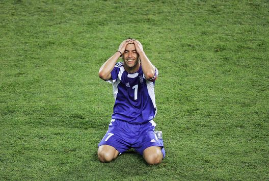 FARO, PORTUGAL - JUNE 20: Theodoros Zagorakis of Greece celebrates his side reaching the Quarter Finals after the UEFA Euro 2004, Group A match between Russia and Greece at the Algarve Stadium, on June 20, 2004 in Faro, Portugal. (Photo by Laurence Griffiths/Getty Images) FARO, PORTUGAL - JUNE 20: Theodoros Zagorakis of Greece celebrates his side reaching the Quarter Finals after the UEFA Euro 2004, Group A match between Russia and Greece at the Algarve Stadium, on June 20, 2004 in Faro, Portugal. (Photo by Laurence Griffiths/Getty Images)