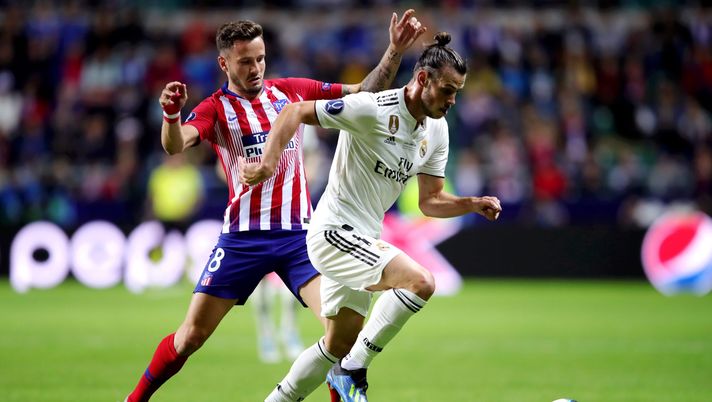 TALLINN, ESTONIA - AUGUST 15:  Gareth Bale of Real Madrid goes past Saul Niguez of Atletico Madrid  during the UEFA Super Cup between Real Madrid and Atletico Madrid at Lillekula Stadium on August 15, 2018 in Tallinn, Estonia.  (Photo by Alexander Hassenstein/Getty Images) 