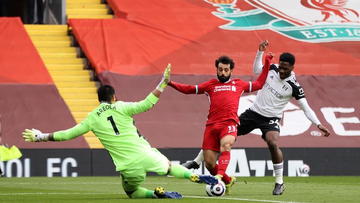 LIVERPOOL, ENGLAND - MARCH 07: Mohamed Salah of Liverpool is challenged by Alphonse Areola and Ola Aina of Fulham during the Premier League match between Liverpool and Fulham at Anfield on March 07, 2021 in Liverpool, England. Sporting stadiums around the UK remain under strict restrictions due to the Coronavirus Pandemic as Government social distancing laws prohibit fans inside venues resulting in games being played behind closed doors. (Photo by Clive Brunskill/Getty Images) LIVERPOOL, ENGLAND - MARCH 07: Mohamed Salah of Liverpool is challenged by Alphonse Areola and Ola Aina of Fulham during the Premier League match between Liverpool and Fulham at Anfield on March 07, 2021 in Liverpool, England. Sporting stadiums around the UK remain under strict restrictions due to the Coronavirus Pandemic as Government social distancing laws prohibit fans inside venues resulting in games being played behind closed doors. (Photo by Clive Brunskill/Getty Images)