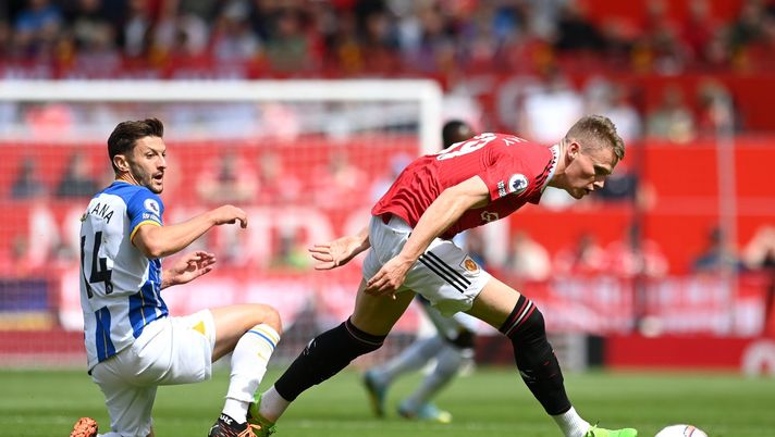 MANCHESTER, ENGLAND - AUGUST 07: Adam Lallana of Brighton & Hove Albion and Scott McTominay of Manchester United battle for the ball during the Premier League match between Manchester United and Brighton & Hove Albion at Old Trafford on August 07, 2022 in Manchester, England. (Photo by Michael Regan/Getty Images) CASEMIRO IN, MCTOMINAY OUT
