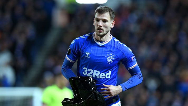 GLASGOW, SCOTLAND - FEBRUARY 20: Borna Barisic of Rangers FC picks rubbish off the pitch during a delay in play during the UEFA Europa League round of 32 first leg match between Rangers FC and Sporting Braga at Ibrox Stadium on February 20, 2020 in Glasgow, United Kingdom. (Photo by Mark Runnacles/Getty Images) GLASGOW, SCOTLAND - FEBRUARY 20: Borna Barisic of Rangers FC picks rubbish off the pitch during a delay in play during the UEFA Europa League round of 32 first leg match between Rangers FC and Sporting Braga at Ibrox Stadium on February 20, 2020 in Glasgow, United Kingdom. (Photo by Mark Runnacles/Getty Images)