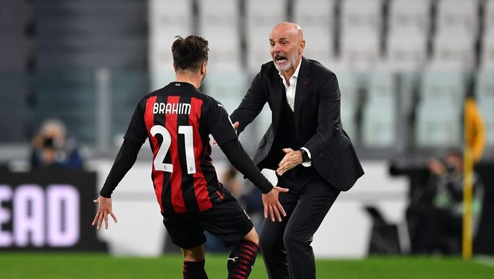 TURIN, ITALY - MAY 09: Brahim Diaz of A.C. Milan celebrates with Stefano Pioli after scoring their side's first goal during the Serie A match between Juventus and AC Milan at on May 09, 2021 in Turin, Italy. Sporting stadiums around Italy remain under strict restrictions due to the Coronavirus Pandemic as Government social distancing laws prohibit fans inside venues resulting in games being played behind closed doors. (Photo by Valerio Pennicino/Getty Images) TURIN, ITALY - MAY 09: Brahim Diaz of A.C. Milan celebrates with Stefano Pioli after scoring their side's first goal during the Serie A match between Juventus and AC Milan at on May 09, 2021 in Turin, Italy. Sporting stadiums around Italy remain under strict restrictions due to the Coronavirus Pandemic as Government social distancing laws prohibit fans inside venues resulting in games being played behind closed doors. (Photo by Valerio Pennicino/Getty Images)