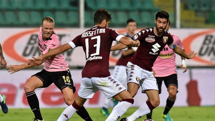PALERMO, ITALY - OCTOBER 17: Luca Rossettini (C) and Marco Benassi (R) of Torino hold off the challange from Oscar Hiljemark of Palermo during the Serie A match between US Citta di Palermo and FC Torino at Stadio Renzo Barbera on October 17, 2016 in Palermo, Italy. (Photo by Tullio M. Puglia/Getty Images) PALERMO, ITALY - OCTOBER 17: Luca Rossettini (C) and Marco Benassi (R) of Torino hold off the challange from Oscar Hiljemark of Palermo during the Serie A match between US Citta di Palermo and FC Torino at Stadio Renzo Barbera on October 17, 2016 in Palermo, Italy. (Photo by Tullio M. Puglia/Getty Images)