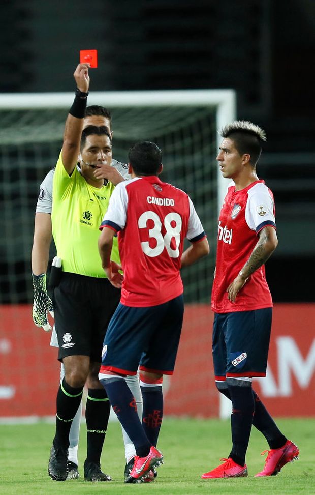 PEREIRA, COLOMBIA - MAY 12: Referee Diego Mirko Haro shows a red card to Camilo Cándido of Nacional during a match between Atletico Nacional and Nacional as part of group F of Copa CONMEBOL Libertadores 2021 at Estadio Hernán Ramírez Villegas on May 12, 2021 in Pereira, Colombia. (Photo by Carlos Ortega - Pool/Getty Images) PEREIRA, COLOMBIA - MAY 12: Referee Diego Mirko Haro shows a red card to Camilo Cándido of Nacional during a match between Atletico Nacional and Nacional as part of group F of Copa CONMEBOL Libertadores 2021 at Estadio Hernán Ramírez Villegas on May 12, 2021 in Pereira, Colombia. (Photo by Carlos Ortega - Pool/Getty Images)