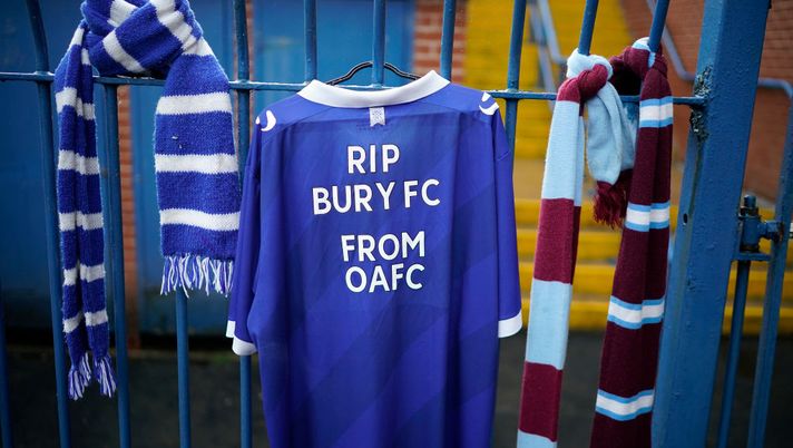 BURY, ENGLAND - AUGUST 28: Football scarves hang from the locked gates of Gigg Lane Stadium the home of Bury Football Club who have been expelled from the English Football League (EFL) on August 28, 2019 in Bury, England. After an historic membership of 125 years the EFL have expelled Bury FC after a buyer for the club was not secured. (Photo by Christopher Furlong/Getty Images) BURY, ENGLAND - AUGUST 28: Football scarves hang from the locked gates of Gigg Lane Stadium the home of Bury Football Club who have been expelled from the English Football League (EFL) on August 28, 2019 in Bury, England. After an historic membership of 125 years the EFL have expelled Bury FC after a buyer for the club was not secured. (Photo by Christopher Furlong/Getty Images)