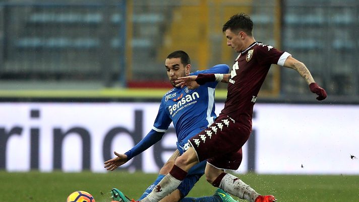 EMPOLI, ITALY - FEBRUARY 05: Giuseppe Bellusci of Empoli FC battles for the ball with Daniele Baselli of FC Torino during the Serie A match between Empoli FC and FC Torino at Stadio Carlo Castellani on February 5, 2017 in Empoli, Italy.  (Photo by Gabriele Maltinti/Getty Images) 
