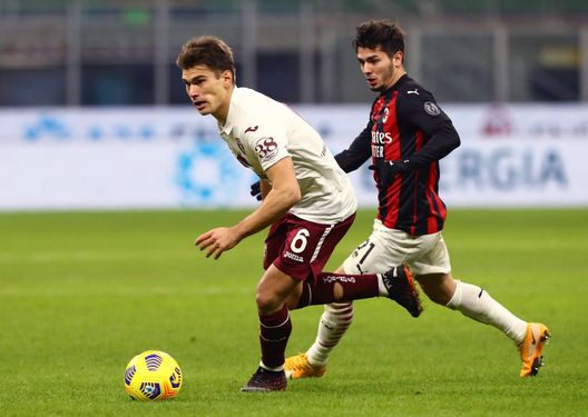 MILAN, ITALY - JANUARY 12: Jacopo Segre of Torino F.C. is challenged by Brahim Diaz of A.C. Milan during the Coppa Italia match between AC Milan and Torino FC at Stadio Giuseppe Meazza on January 12, 2021 in Milan, Italy. Sporting stadiums around Italy remain under strict restrictions due to the Coronavirus Pandemic as Government social distancing laws prohibit fans inside venues resulting in games being played behind closed doors. (Photo by Marco Luzzani/Getty Images) MILAN, ITALY - JANUARY 12: Jacopo Segre of Torino F.C. is challenged by Brahim Diaz of A.C. Milan during the Coppa Italia match between AC Milan and Torino FC at Stadio Giuseppe Meazza on January 12, 2021 in Milan, Italy. Sporting stadiums around Italy remain under strict restrictions due to the Coronavirus Pandemic as Government social distancing laws prohibit fans inside venues resulting in games being played behind closed doors. (Photo by Marco Luzzani/Getty Images)