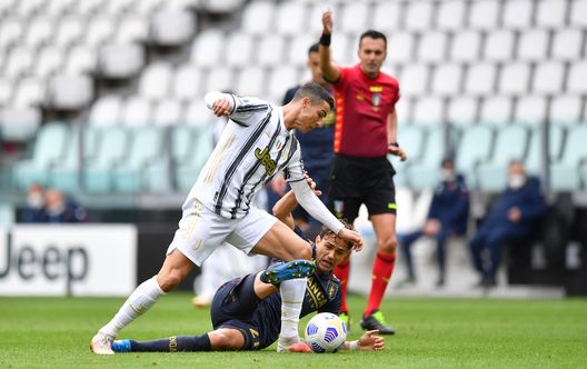 TURIN, ITALY - APRIL 11: Cristiano Ronaldo of Juventus Ivan Radovanovic of Genoa C.F.C. during the Serie A match between Juventus and Genoa CFC at Allianz Stadium on April 11, 2021 in Turin, Italy. Sporting stadiums around Italy remain under strict restrictions due to the Coronavirus Pandemic as Government social distancing laws prohibit fans inside venues resulting in games being played behind closed doors. (Photo by Valerio Pennicino/Getty Images) TURIN, ITALY - APRIL 11: Cristiano Ronaldo of Juventus Ivan Radovanovic of Genoa C.F.C. during the Serie A match between Juventus and Genoa CFC at Allianz Stadium on April 11, 2021 in Turin, Italy. Sporting stadiums around Italy remain under strict restrictions due to the Coronavirus Pandemic as Government social distancing laws prohibit fans inside venues resulting in games being played behind closed doors. (Photo by Valerio Pennicino/Getty Images)