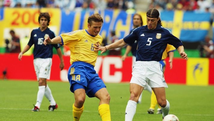 MIYAGI - JUNE 12:   Matias Almeyda of Argentina shields the ball from Anders Svensson of Sweden during the Group F match of the World Cup Group Stage played at the Miyagi Stadium, Miyagi, Japan on June 12, 2002. (Photo by Laurence Griffiths/Getty Images)The match ended in a 1-1 draw. 