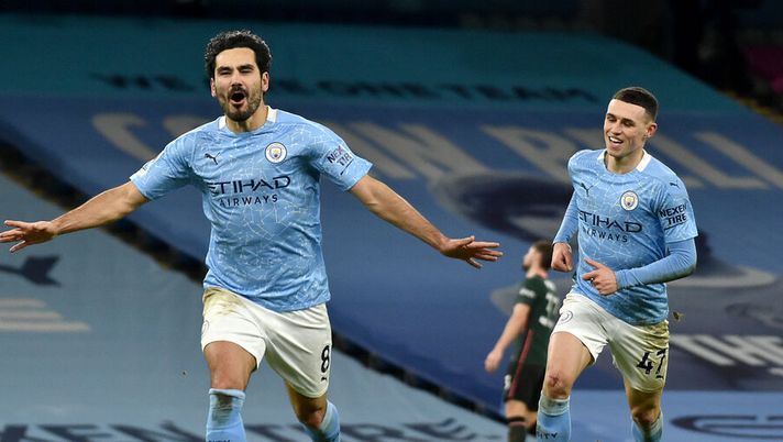 MANCHESTER, ENGLAND - FEBRUARY 13: Ilkay Gundogan of Manchester City celebrates after scoring their side's third goal during the Premier League match between Manchester City and Tottenham Hotspur at Etihad Stadium on February 13, 2021 in Manchester, England. Sporting stadiums around the UK remain under strict restrictions due to the Coronavirus Pandemic as Government social distancing laws prohibit fans inside venues resulting in games being played behind closed doors. (Photo by Rui Vieira - Pool/Getty Images) Gundogan, calciatore invidiato: “Molti colleghi sono gelosi di me perché ho lavorato sia con Klopp che con Guardiola” - immagine 1
