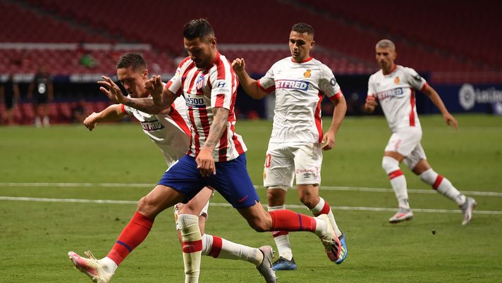 MADRID, SPAIN - JULY 03: Vitolo of Atletico challenged by Antonio Raillo of Mallorca during the Liga match between Club Atletico de Madrid and RCD Mallorca at Wanda Metropolitano on July 03, 2020 in Madrid, Spain. Football Stadiums around Europe remain empty due to the Coronavirus Pandemic as Government social distancing laws prohibit fans inside venues resulting in all fixtures being played behind closed doors. (Photo by Denis Doyle/Getty Images) MADRID, SPAIN - JULY 03: Vitolo of Atletico challenged by Antonio Raillo of Mallorca during the Liga match between Club Atletico de Madrid and RCD Mallorca at Wanda Metropolitano on July 03, 2020 in Madrid, Spain. Football Stadiums around Europe remain empty due to the Coronavirus Pandemic as Government social distancing laws prohibit fans inside venues resulting in all fixtures being played behind closed doors. (Photo by Denis Doyle/Getty Images)