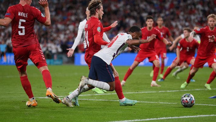 LONDON, ENGLAND - JULY 07: Raheem Sterling of England is fouled by Mathias Jensen of Denmark inside the penalty area, leading to England being awarded a penalty during the UEFA Euro 2020 Championship Semi-final match between England and Denmark at Wembley Stadium on July 07, 2021 in London, England. (Photo by Laurence Griffiths/Getty Images) LONDON, ENGLAND - JULY 07: Raheem Sterling of England is fouled by Mathias Jensen of Denmark inside the penalty area, leading to England being awarded a penalty during the UEFA Euro 2020 Championship Semi-final match between England and Denmark at Wembley Stadium on July 07, 2021 in London, England. (Photo by Laurence Griffiths/Getty Images)