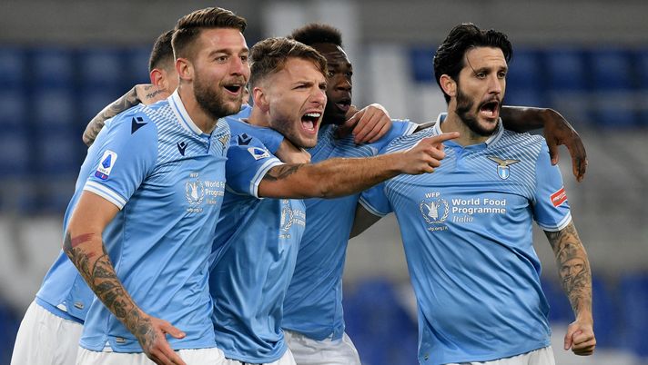 ROME, ITALY - DECEMBER 20: Ciro Immobile of SS Lazio celebrate a opening goal with his team mates during the Serie A match between SS Lazio and SSC Napoli at Stadio Olimpico on December 20, 2020 in Rome, Italy. Sporting stadiums around Italy remain under strict restrictions due to the Coronavirus Pandemic as Government social distancing laws prohibit fans inside venues resulting in games being played behind closed doors. (Photo by Marco Rosi - SS Lazio/Getty Images) ROME, ITALY - DECEMBER 20: Ciro Immobile of SS Lazio celebrate a opening goal with his team mates during the Serie A match between SS Lazio and SSC Napoli at Stadio Olimpico on December 20, 2020 in Rome, Italy. Sporting stadiums around Italy remain under strict restrictions due to the Coronavirus Pandemic as Government social distancing laws prohibit fans inside venues resulting in games being played behind closed doors. (Photo by Marco Rosi - SS Lazio/Getty Images)
