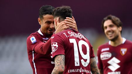 TURIN, ITALY - APRIL 03: Antonio Sanabria of Torino F.C. celebrates with teammate Armando Izzo after scoring their team's second goal during the Serie A match between Torino FC and Juventus at Stadio Olimpico di Torino on April 03, 2021 in Turin, Italy. Sporting stadiums around Italy remain under strict restrictions due to the Coronavirus Pandemic as Government social distancing laws prohibit fans inside venues resulting in games being played behind closed doors. (Photo by Valerio Pennicino/Getty Images)