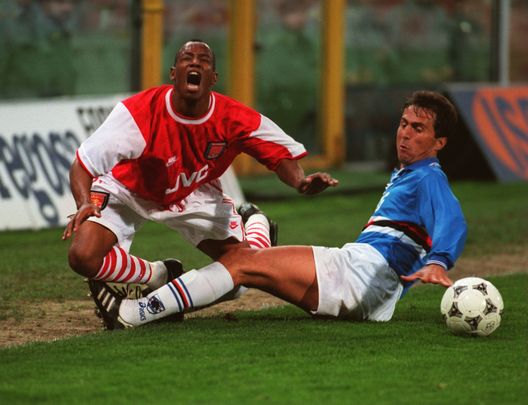 20 APR 1995: IAN WRIGHT OF ARSENAL IS FOULED BY RICCARDO FERRI OF SAMPDORIA DURING THE EUROPEAN CUP WINNERS CUP SEMI-FINAL MATCH BETWEEN SAMPDORIA AND ARSENAL PLAYED AT THE LUIGI FERRARIS STADIUM IN GENOA. Mandatory Credit: Ben Radford/ALLSPORT 20 APR 1995: IAN WRIGHT OF ARSENAL IS FOULED BY RICCARDO FERRI OF SAMPDORIA DURING THE EUROPEAN CUP WINNERS CUP SEMI-FINAL MATCH BETWEEN SAMPDORIA AND ARSENAL PLAYED AT THE LUIGI FERRARIS STADIUM IN GENOA. Mandatory Credit: Ben Radford/ALLSPORT