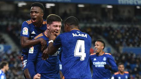 SAN SEBASTIAN, SPAIN - DECEMBER 04: Luka Jovic of Real Madrid celebrates with teammates Vinicius Junior and David Alaba after scoring their side's second goal during the La Liga Santander match between Real Sociedad and Real Madrid CF at Reale Arena on December 04, 2021 in San Sebastian, Spain. (Photo by Juan Manuel Serrano Arce/Getty Images)