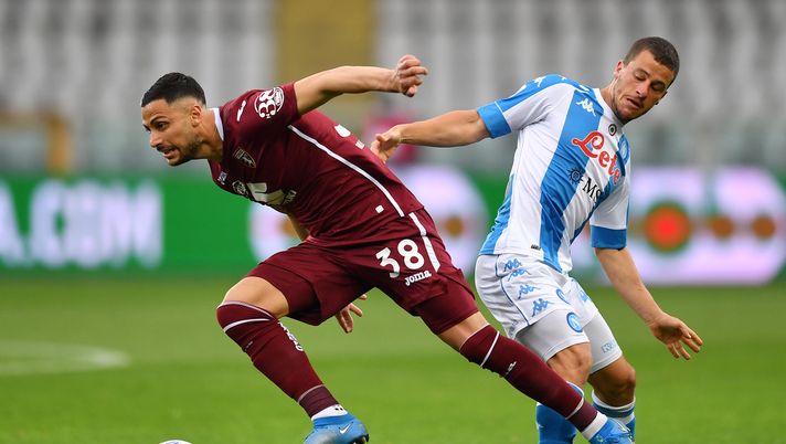 TURIN, ITALY - APRIL 26: Rolando Mandragora of Torino FC is tackled by Diego Demme of SSC Napoli during the Serie A match between Torino FC and SSC Napoli at Stadio Olimpico di Torino on April 26, 2021 in Turin, Italy. Sporting stadiums around Italy remain under strict restrictions due to the Coronavirus Pandemic as Government social distancing laws prohibit fans inside venues resulting in games being played behind closed doors. (Photo by Valerio Pennicino/Getty Images) 