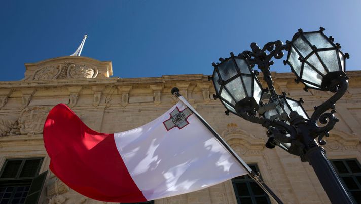 VALLETTA, MALTA - MARCH 11: A Maltese flag flies outside the Auberge de Castille on March 11, 2018 in Valletta, Malta. This series of images forms part of an investigation by the Guardian newspaper into the murdered journalist Daphne Caruana Galizia. Daphne Caruana Galizia, 53, was a Maltese journalist and anti-corruption blogger and was killed by a car bomb on October 16, 2017. (Photo by Dan Kitwood/Getty Images for the Daphne Project ) VALLETTA, MALTA - MARCH 11: A Maltese flag flies outside the Auberge de Castille on March 11, 2018 in Valletta, Malta. This series of images forms part of an investigation by the Guardian newspaper into the murdered journalist Daphne Caruana Galizia. Daphne Caruana Galizia, 53, was a Maltese journalist and anti-corruption blogger and was killed by a car bomb on October 16, 2017. (Photo by Dan Kitwood/Getty Images for the Daphne Project )