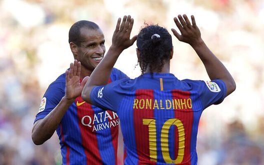 Former FC Barcelona player Ronaldinho, right, gestures to his teammate Rivaldo during the friendly soccer match between FC Barcelona legends and Manchester United legends at the Camp Nou stadium in Barcelona, Spain, Friday, June, 30, 2017. (AP Photo/Manu Fernandez) Former FC Barcelona player Ronaldinho, right, gestures to his teammate Rivaldo during the friendly soccer match between FC Barcelona legends and Manchester United legends at the Camp Nou stadium in Barcelona, Spain, Friday, June, 30, 2017. (AP Photo/Manu Fernandez)