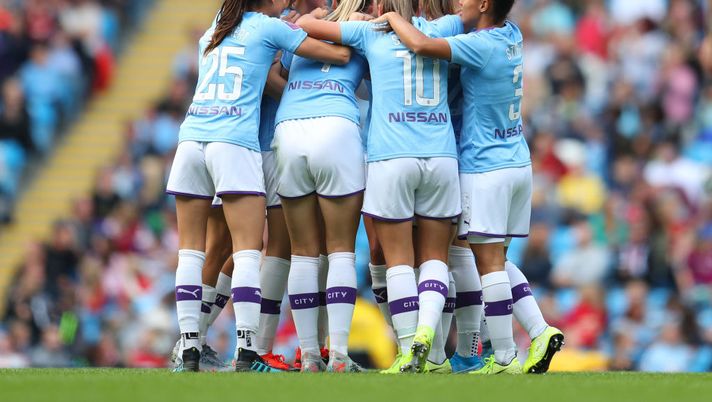 MANCHESTER, ENGLAND - SEPTEMBER 07: Caroline Weir of Manchester City (obscured) celebrates after scoring her team's first goal with team mates during the Barclays FA Women's Super League match between Manchester City and Manchester United at Etihad Stadium on September 07, 2019 in Manchester, United Kingdom. (Photo by Catherine Ivill/Getty Images) 