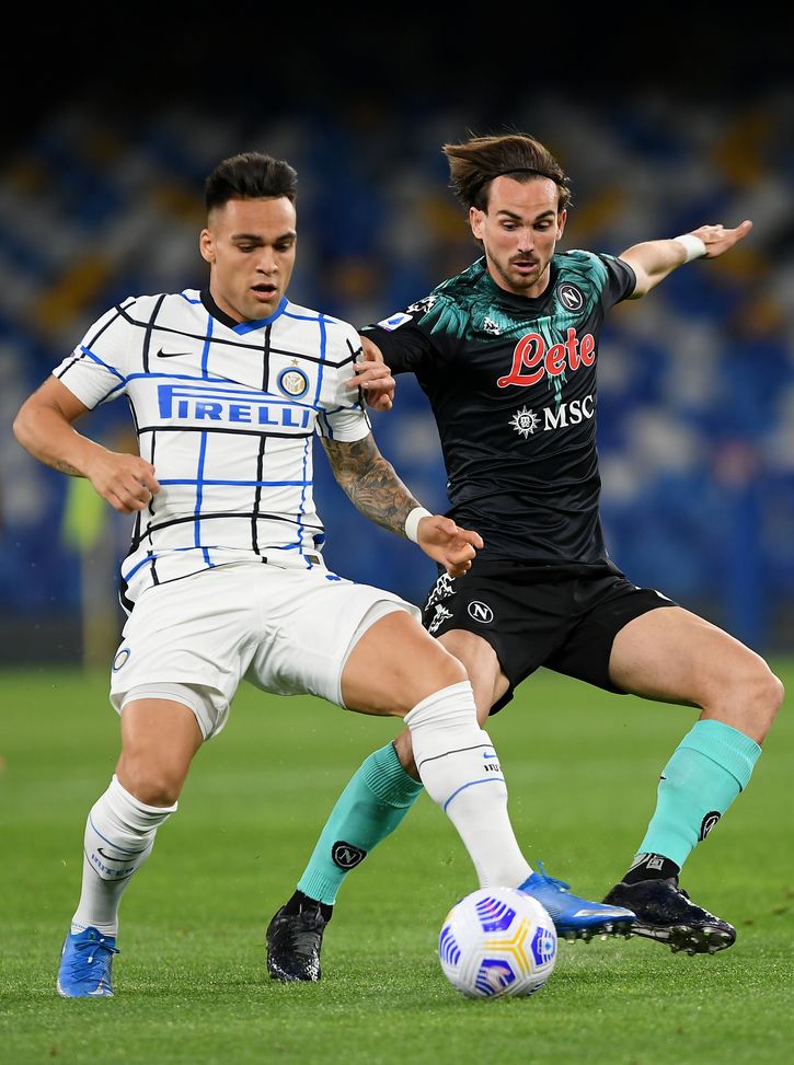 NAPLES, ITALY - APRIL 18: Lautaro Martinez of FC Internazionale and Fabian of Napoli battle for the ball during the Serie A match between SSC Napoli and FC Internazionale at Stadio Diego Armando Maradona on April 18, 2021 in Naples, Italy. Sporting stadiums around Italy remain under strict restrictions due to the Coronavirus Pandemic as Government social distancing laws prohibit fans inside venues resulting in games being played behind closed doors. (Photo by Francesco Pecoraro/Getty Images) NAPLES, ITALY - APRIL 18: Lautaro Martinez of FC Internazionale and Fabian of Napoli battle for the ball during the Serie A match between SSC Napoli and FC Internazionale at Stadio Diego Armando Maradona on April 18, 2021 in Naples, Italy. Sporting stadiums around Italy remain under strict restrictions due to the Coronavirus Pandemic as Government social distancing laws prohibit fans inside venues resulting in games being played behind closed doors. (Photo by Francesco Pecoraro/Getty Images)