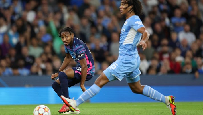 MANCHESTER, ENGLAND - SEPTEMBER 15: Christopher Nkunku of RB Leipzig shoots wide past Nathan Ake of Manchester City during the UEFA Champions League group A match between Manchester City and RB Leipzig at Etihad Stadium on September 15, 2021 in Manchester, England. (Photo by Richard Heathcote/Getty Images) Champions League