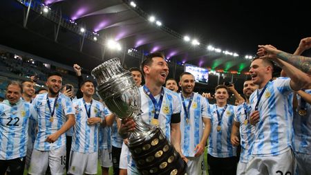 RIO DE JANEIRO, BRAZIL - JULY 10: Lionel Messi of Argentina smiles with the trophy as he celebrates with teammates after winning the final of Copa America Brazil 2021 between Brazil and Argentina at Maracana Stadium on July 10, 2021 in Rio de Janeiro, Brazil. (Photo by Buda Mendes/Getty Images)