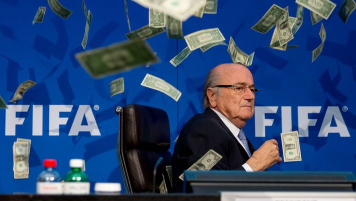 ZURICH, SWITZERLAND - JULY 20: Comedian Simon Brodkin (not pictured) throws cash at FIFA President Joseph S. Blatter during a press conference at the Extraordinary FIFA Executive Committee Meeting at the FIFA headquarters on July 20, 2015 in Zurich, Switzerland. (Photo by Philipp Schmidli/Getty Images) ZURICH, SWITZERLAND - JULY 20: Comedian Simon Brodkin (not pictured) throws cash at FIFA President Joseph S. Blatter during a press conference at the Extraordinary FIFA Executive Committee Meeting at the FIFA headquarters on July 20, 2015 in Zurich, Switzerland. (Photo by Philipp Schmidli/Getty Images)