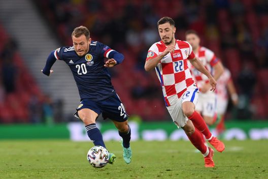 GLASGOW, SCOTLAND - JUNE 22: Ryan Fraser of Scotland runs with the ball as he is closed down by Josip Juranovic of Croatia during the UEFA Euro 2020 Championship Group D match between Croatia and Scotland at Hampden Park on June 22, 2021 in Glasgow, Scotland. (Photo by Stu Forster/Getty Images) GLASGOW, SCOTLAND - JUNE 22: Ryan Fraser of Scotland runs with the ball as he is closed down by Josip Juranovic of Croatia during the UEFA Euro 2020 Championship Group D match between Croatia and Scotland at Hampden Park on June 22, 2021 in Glasgow, Scotland. (Photo by Stu Forster/Getty Images)