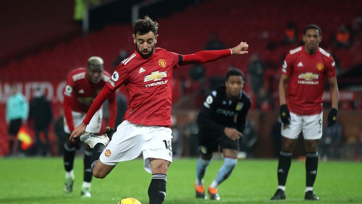 MANCHESTER, ENGLAND - JANUARY 01: Bruno Fernandes of Manchester United scores their team's second goal from the penalty spot during the Premier League match between Manchester United and Aston Villa at Old Trafford on January 01, 2021 in Manchester, England. The match will be played without fans, behind closed doors as a Covid-19 precaution. (Photo by Carl Recine - Pool/Getty Images) MANCHESTER, ENGLAND - JANUARY 01: Bruno Fernandes of Manchester United scores their team's second goal from the penalty spot during the Premier League match between Manchester United and Aston Villa at Old Trafford on January 01, 2021 in Manchester, England. The match will be played without fans, behind closed doors as a Covid-19 precaution. (Photo by Carl Recine - Pool/Getty Images)