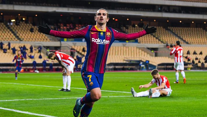 SEVILLE, SPAIN - JANUARY 17: Antoine Griezmann of FC Barcelona celebrates after scoring his team's second goal during the Supercopa de Espana Final match between FC Barcelona and Athletic Club at Estadio de La Cartuja on January 17, 2021 in Seville, Spain. Sporting stadiums around Spain remain under strict restrictions due to the Coronavirus Pandemic as Government social distancing laws prohibit fans inside venues resulting in games being played behind closed doors. (Photo by David Ramos/Getty Images) SEVILLE, SPAIN - JANUARY 17: Antoine Griezmann of FC Barcelona celebrates after scoring his team's second goal during the Supercopa de Espana Final match between FC Barcelona and Athletic Club at Estadio de La Cartuja on January 17, 2021 in Seville, Spain. Sporting stadiums around Spain remain under strict restrictions due to the Coronavirus Pandemic as Government social distancing laws prohibit fans inside venues resulting in games being played behind closed doors. (Photo by David Ramos/Getty Images)