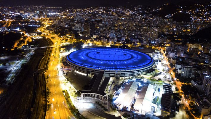 RIO DE JANEIRO, BRAZIL - JUNE 16: An aerial view of the Maracana stadium illuminated in blue amidst the coronavirus (COVID-19) pandemic on June 16, 2020 in Rio de Janeiro, Brazil. The Maracana stadium is 70 years old and to celebrate the date it received special lighting that alludes to the Flamengo and Fluminense teams, managers of the stadium. Simultaneously with the stadium, the statue of Christ, the Redeemer also received blue lighting, a color that symbolizes health workers who work tirelessly in the fight against the coronavirus (COVID-19). (Photo by Buda Mendes/Getty Images) RIO DE JANEIRO, BRAZIL - JUNE 16: An aerial view of the Maracana stadium illuminated in blue amidst the coronavirus (COVID-19) pandemic on June 16, 2020 in Rio de Janeiro, Brazil. The Maracana stadium is 70 years old and to celebrate the date it received special lighting that alludes to the Flamengo and Fluminense teams, managers of the stadium. Simultaneously with the stadium, the statue of Christ, the Redeemer also received blue lighting, a color that symbolizes health workers who work tirelessly in the fight against the coronavirus (COVID-19). (Photo by Buda Mendes/Getty Images)