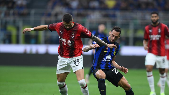 MILAN, ITALY - SEPTEMBER 16: Hakan Calhanoglu of FC Internazionale in action, battles for the ball with Rade Krunic of AC Milan during the Serie A TIM match between FC Internazionale and AC Milan at Stadio Giuseppe Meazza on September 16, 2023 in Milan, Italy. (Photo by Mattia Pistoia - Inter/Inter via Getty Images) FC Internazionale v AC Milan - Serie A TIM
