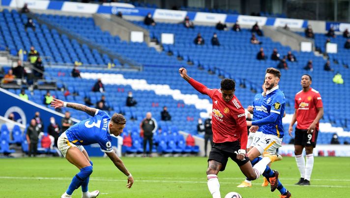 BRIGHTON, ENGLAND - SEPTEMBER 26: Marcus Rashford of Manchester United scores his team's second goal during the Premier League match between Brighton & Hove Albion and Manchester United at American Express Community Stadium on September 26, 2020 in Brighton, England. Sporting stadiums around the UK remain under strict restrictions due to the Coronavirus Pandemic as Government social distancing laws prohibit fans inside venues resulting in games being played behind closed doors. (Photo by Glyn Kirk - Pool/Getty Images) BRIGHTON, ENGLAND - SEPTEMBER 26: Marcus Rashford of Manchester United scores his team's second goal during the Premier League match between Brighton & Hove Albion and Manchester United at American Express Community Stadium on September 26, 2020 in Brighton, England. Sporting stadiums around the UK remain under strict restrictions due to the Coronavirus Pandemic as Government social distancing laws prohibit fans inside venues resulting in games being played behind closed doors. (Photo by Glyn Kirk - Pool/Getty Images)