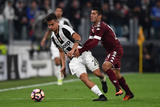 TURIN, ITALY - MAY 06: Paulo Dybala (L) of Juventus FC is challenged by Iago Falque of FC Torino during the Serie A match between Juventus FC and FC Torino at Juventus Stadium on May 6, 2017 in Turin, Italy. (Photo by Valerio Pennicino/Getty Images) TURIN, ITALY - MAY 06: Paulo Dybala (L) of Juventus FC is challenged by Iago Falque of FC Torino during the Serie A match between Juventus FC and FC Torino at Juventus Stadium on May 6, 2017 in Turin, Italy. (Photo by Valerio Pennicino/Getty Images)
