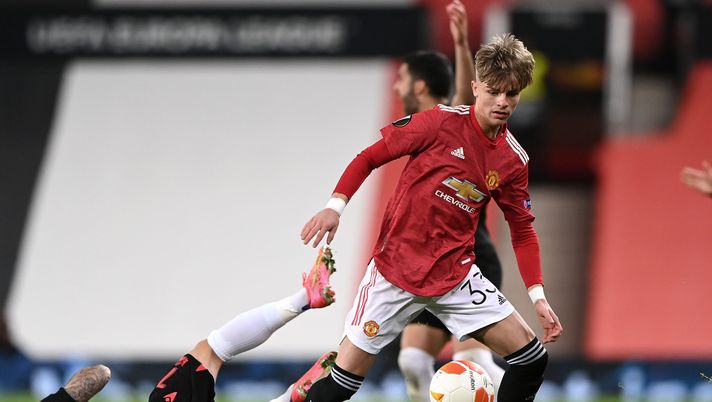 MANCHESTER, ENGLAND - FEBRUARY 25: Brandon Williams of Manchester United battles for possession with Portu of Real Sociedad during the UEFA Europa League Round of 32 match between Manchester United and Real Sociedad at Old Trafford on February 25, 2021 in Manchester, England. Sporting stadiums around the UK remain under strict restrictions due to the Coronavirus Pandemic as Government social distancing laws prohibit fans inside venues resulting in games being played behind closed doors. (Photo by Laurence Griffiths/Getty Images) MANCHESTER, ENGLAND - FEBRUARY 25: Brandon Williams of Manchester United battles for possession with Portu of Real Sociedad during the UEFA Europa League Round of 32 match between Manchester United and Real Sociedad at Old Trafford on February 25, 2021 in Manchester, England. Sporting stadiums around the UK remain under strict restrictions due to the Coronavirus Pandemic as Government social distancing laws prohibit fans inside venues resulting in games being played behind closed doors. (Photo by Laurence Griffiths/Getty Images)