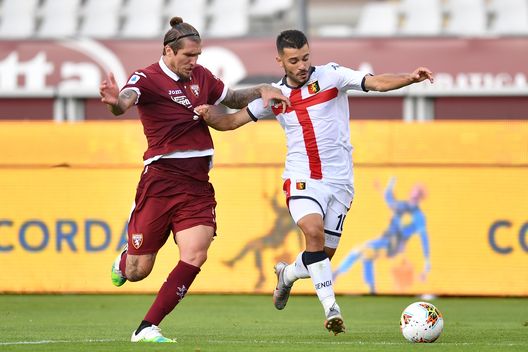  TURIN, ITALY - JULY 16: Vojnovic Lyanco (L) of Torino FC competes with Iago Falque of Genoa CFC during the Serie A match between Torino FC and Genoa CFC at Stadio Olimpico di Torino on July 16, 2020 in Turin, Italy. (Photo by Valerio Pennicino/Getty Images) 