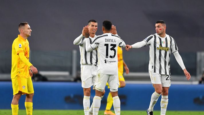 TURIN, ITALY - NOVEMBER 21: Cristiano Ronaldo of Juventus celebrates with teammate Danilo after scoring his team's first goal during the Serie A match between Juventus and Cagliari Calcio at Allianz Stadium on November 21, 2020 in Turin, Italy. Football Stadiums around Europe remain empty due to the Coronavirus Pandemic as Government social distancing laws prohibit fans inside venues resulting in fixtures being played behind closed doors. (Photo by Valerio Pennicino/Getty Images) TURIN, ITALY - NOVEMBER 21: Cristiano Ronaldo of Juventus celebrates with teammate Danilo after scoring his team's first goal during the Serie A match between Juventus and Cagliari Calcio at Allianz Stadium on November 21, 2020 in Turin, Italy. Football Stadiums around Europe remain empty due to the Coronavirus Pandemic as Government social distancing laws prohibit fans inside venues resulting in fixtures being played behind closed doors. (Photo by Valerio Pennicino/Getty Images)