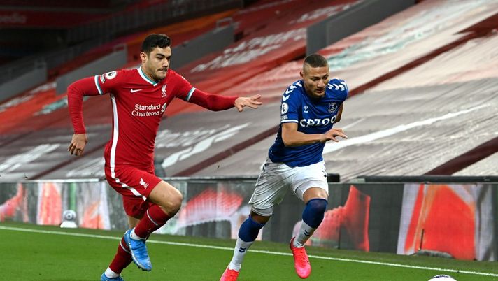 LIVERPOOL, ENGLAND - FEBRUARY 20: Ozan Kabak of Liverpool battles for possession with Richarlison of Everton during the Premier League match between Liverpool and Everton at Anfield on February 20, 2021 in Liverpool, England. Sporting stadiums around the UK remain under strict restrictions due to the Coronavirus Pandemic as Government social distancing laws prohibit fans inside venues resulting in games being played behind closed doors. (Photo by Paul Ellis - Pool/Getty Images) 