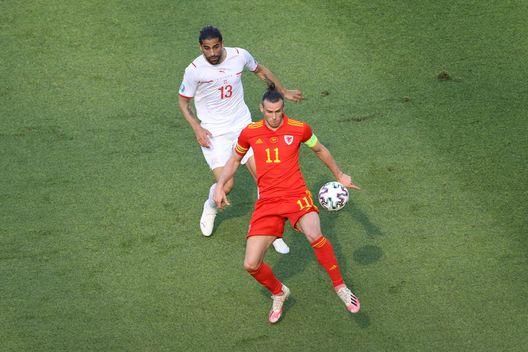 BAKU, AZERBAIJAN - JUNE 12: Gareth Bale of Wales is closed down by Ricardo Rodriguez of Switzerland during the UEFA Euro 2020 Championship Group A match between Wales and Switzerland at the Baku Olympic Stadium on June 12, 2021 in Baku, Azerbaijan. (Photo by Naomi Baker/Getty Images) BAKU, AZERBAIJAN - JUNE 12: Gareth Bale of Wales is closed down by Ricardo Rodriguez of Switzerland during the UEFA Euro 2020 Championship Group A match between Wales and Switzerland at the Baku Olympic Stadium on June 12, 2021 in Baku, Azerbaijan. (Photo by Naomi Baker/Getty Images)
