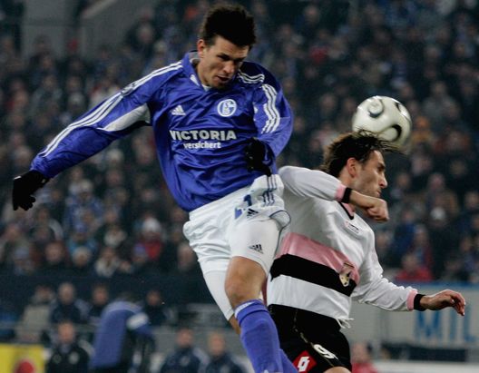 GELSENKIRCHEN, GERMANY - MARCH 16: Zlatan Bajramovic of Schalke and Denis Godeas of Palermo go up for a header during the UEFA Cup Round of 16 second leg match between Schalke 04 and US Citta di Palermo at the Veltins Arena on March 16, 2006 in Gelsenkirchen, Germany. (Photo by Christof Koepsel/Bongarts/Getty Images) GELSENKIRCHEN, GERMANY - MARCH 16: Zlatan Bajramovic of Schalke and Denis Godeas of Palermo go up for a header during the UEFA Cup Round of 16 second leg match between Schalke 04 and US Citta di Palermo at the Veltins Arena on March 16, 2006 in Gelsenkirchen, Germany. (Photo by Christof Koepsel/Bongarts/Getty Images)